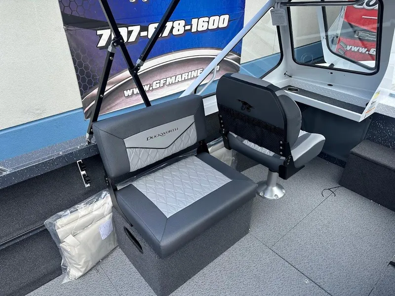 Slide: The Image of 2025 Duckworth 18 Advantage boat interior with gray seating and modern design. - 17