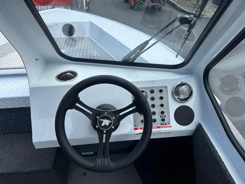 Slide: The Image of 2025 Duckworth 18 Advantage boat dashboard with steering wheel and control panel. - 25
