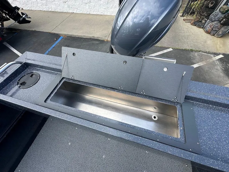 Slide: The Image of Open storage compartment on 2025 Duckworth 18 Advantage boat deck. - 32