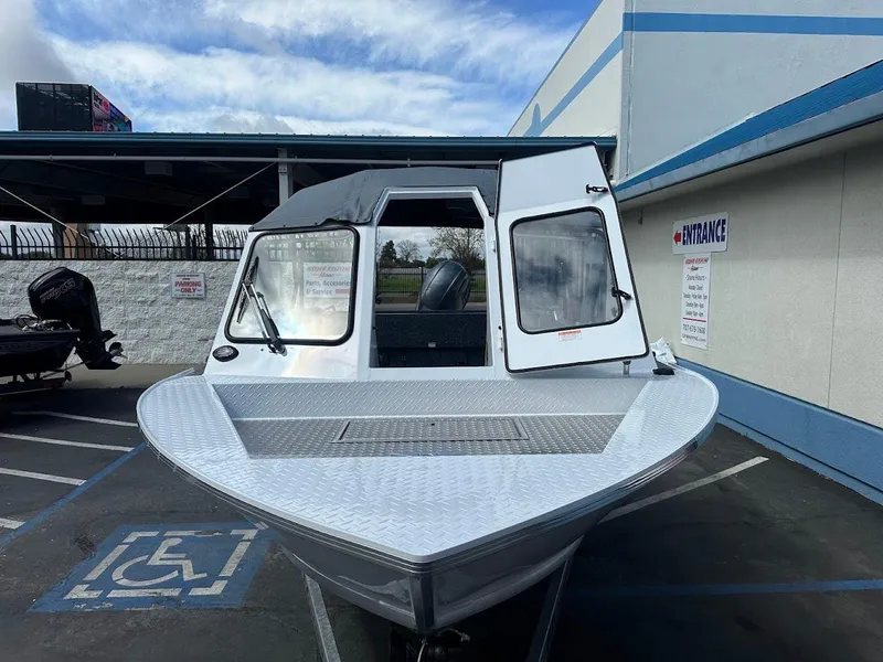 Slide: The Image of 2025 Duckworth 18 Advantage boat parked in a lot, front view. - 4