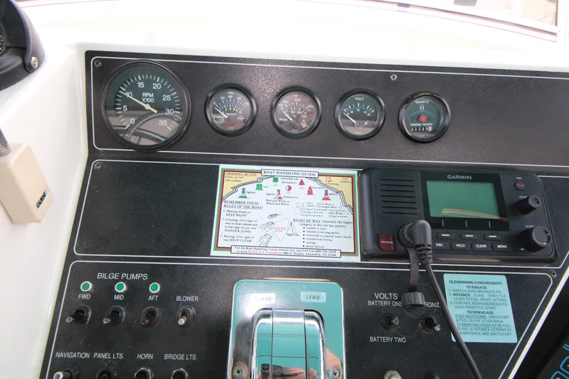Slide: The Image of Control panel of a 1994 Carver 440 Aft Cabin Motor Yacht with gauges and navigation equipment. - 34