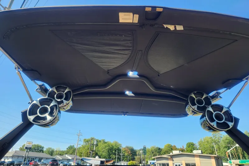 Slide: The Image of 2021 Malibu Wakesetter 24 MXZ boat speakers and canopy, viewed from below. - 19