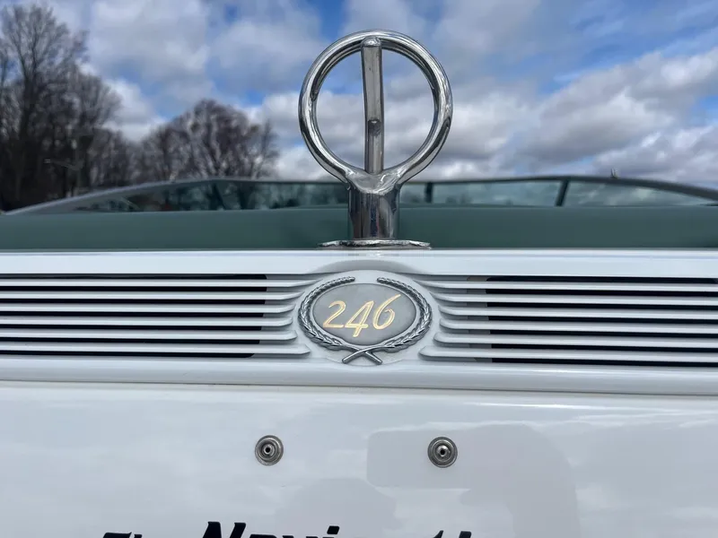 Slide: The Image of 2002 Cobalt 246 boat emblem with cloudy sky background. - 18