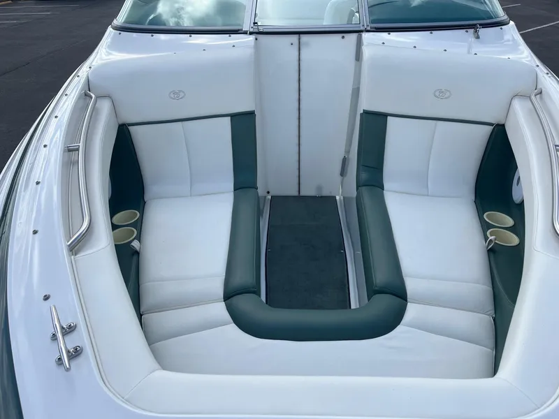 Slide: The Image of Interior of 2002 Cobalt 246 boat with white and green seating. - 9