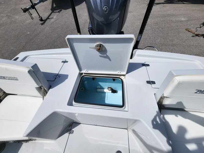 Slide: The Image of 2023 Pathfinder 2500 Hybrid boat with open storage compartment on deck. - 13
