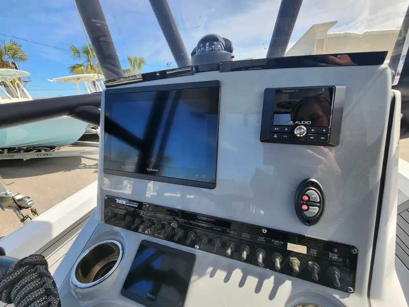 Slide: The Image of 2023 Pathfinder 2500 Hybrid boat dashboard with navigation and control systems. - 15