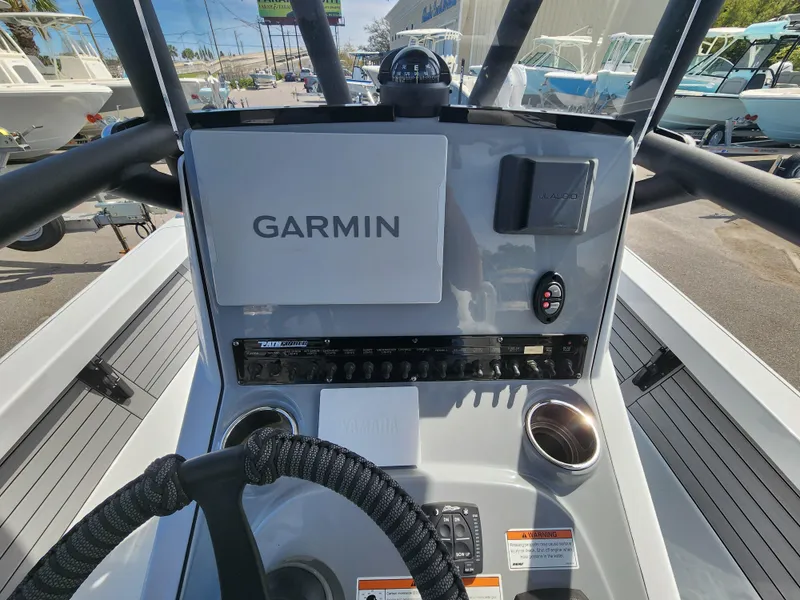 Slide: The Image of 2023 Pathfinder 2500 Hybrid boat dashboard with Garmin navigation system. - 16