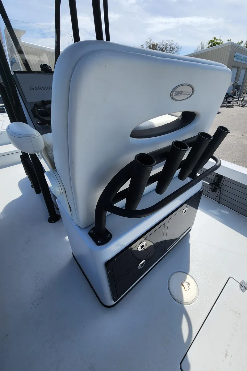 Slide: The Image of 2023 Pathfinder 2500 Hybrid boat seat with rod holders and storage compartments. - 19
