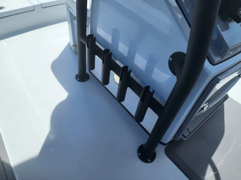 Slide: The Image of 2023 Pathfinder 2500 Hybrid boat interior with rod holders and console. - 29