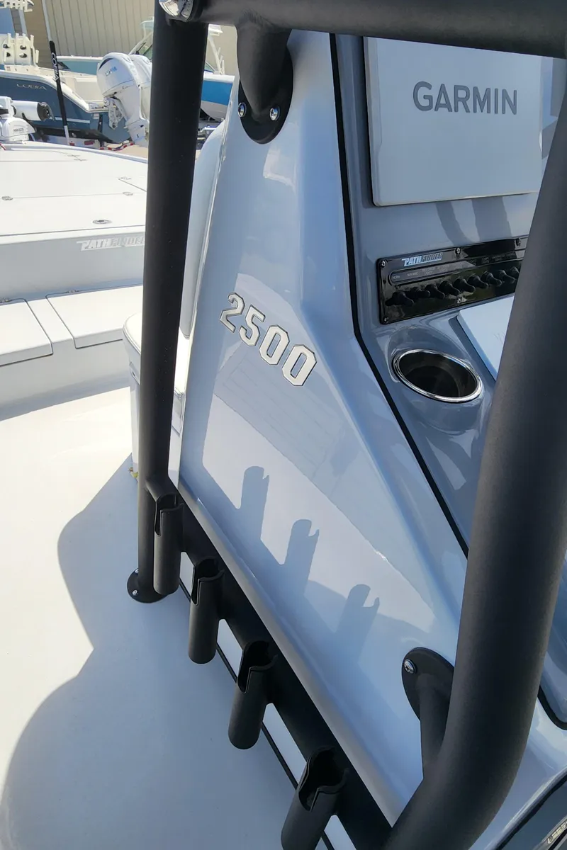 Slide: The Image of 2023 Pathfinder 2500 Hybrid boat with Garmin electronics, featuring sleek design and rod holders. - 30