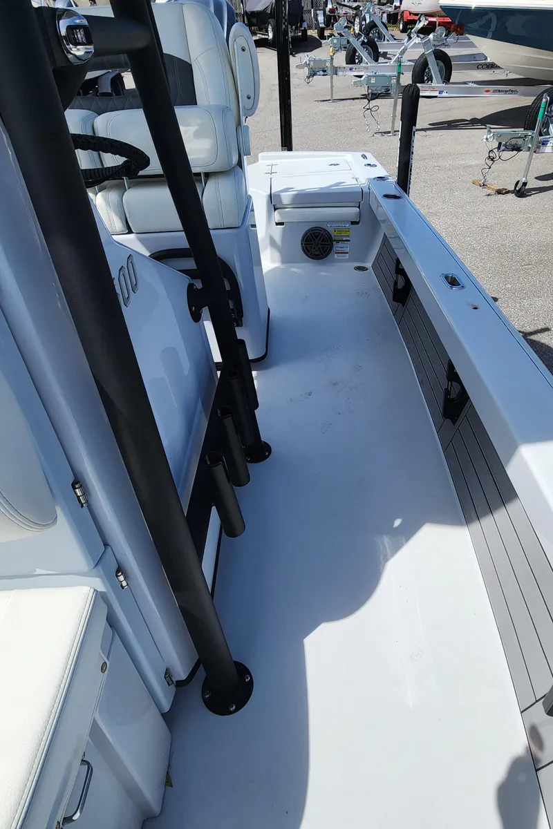 Slide: The Image of 2023 Pathfinder 2500 Hybrid boat interior with seating and storage compartments. - 32