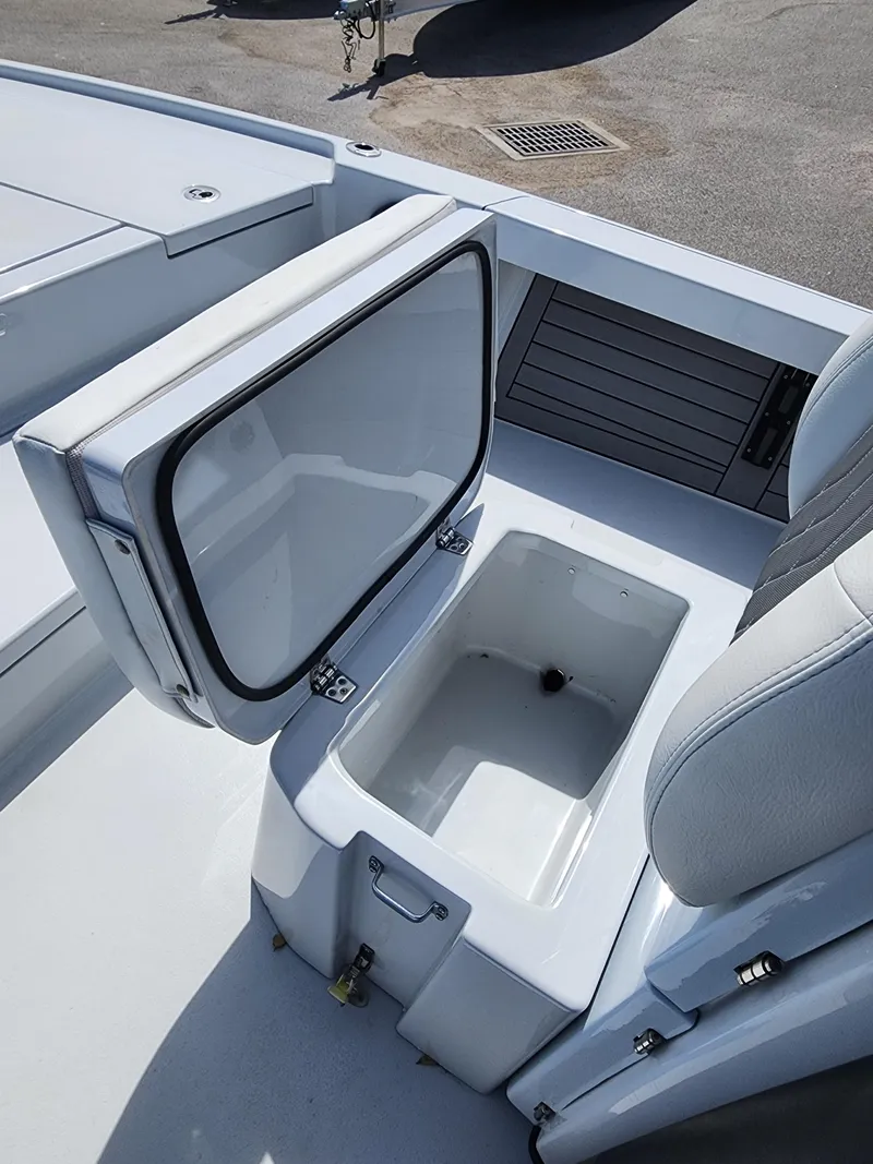 Slide: The Image of 2023 Pathfinder 2500 Hybrid boat with open storage compartment on deck. - 34
