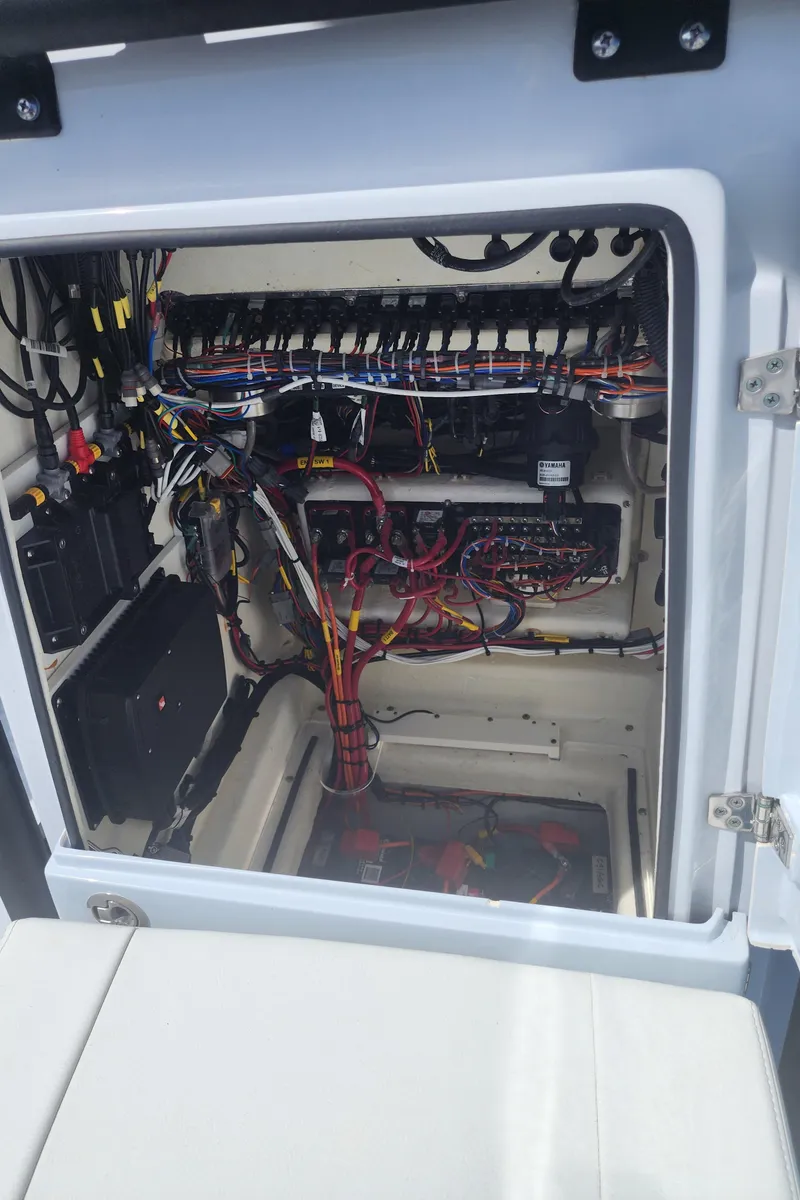 Slide: The Image of Electrical compartment of 2023 Pathfinder 2500 Hybrid boat, showcasing wiring and components. - 35