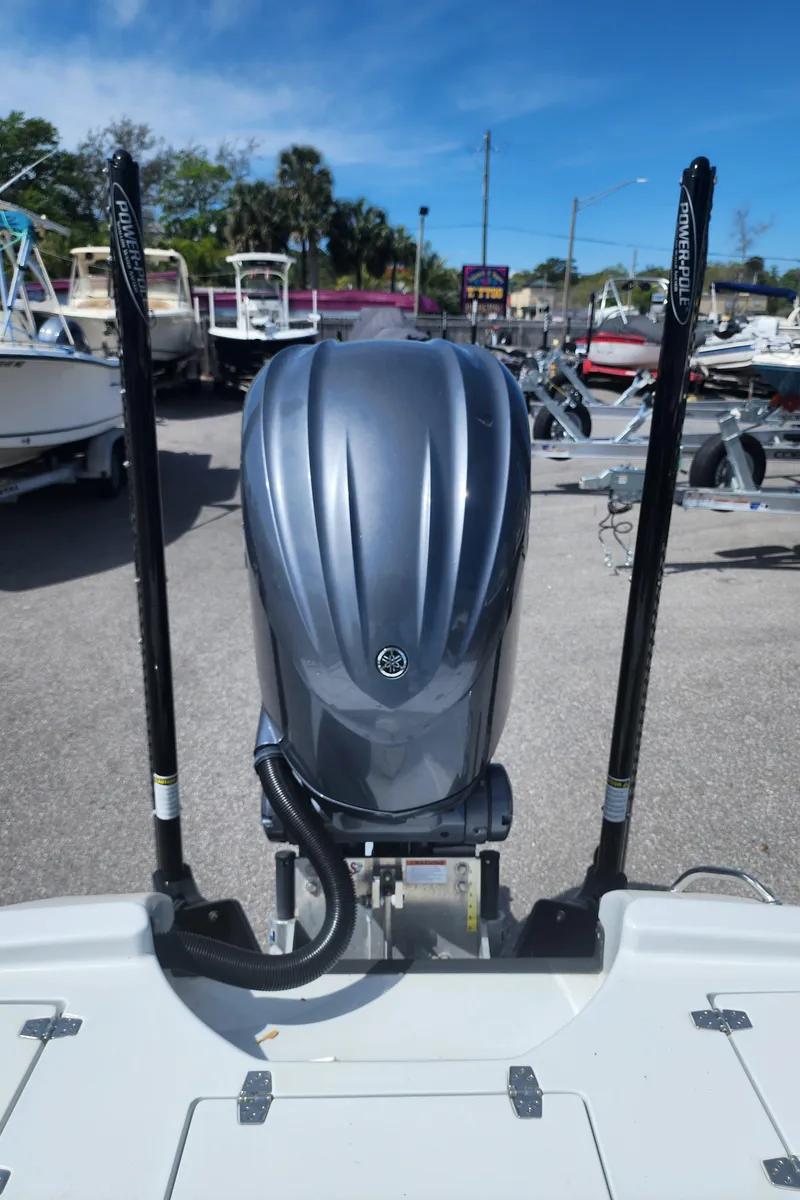 Slide: The Image of 2023 Pathfinder 2500 Hybrid boat engine at a marina under clear blue sky. - 37