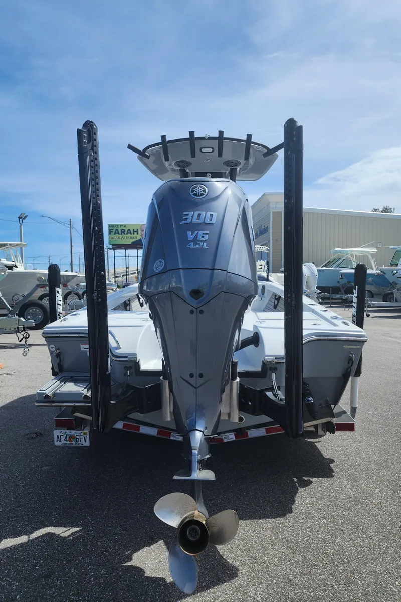 Slide: The Image of 2023 Pathfinder 2500 Hybrid boat with powerful 300 V6 engine, displayed outdoors. - 6