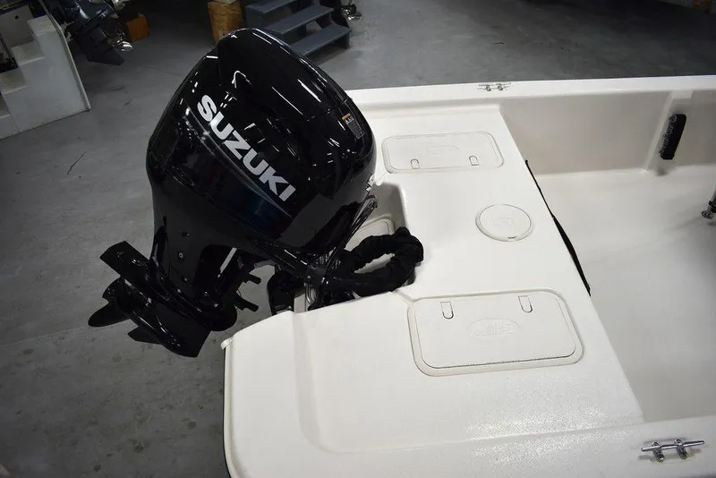 Slide: The Image of 2025 Carolina Skiff E20 JVX Center Console with Suzuki outboard motor. - 12