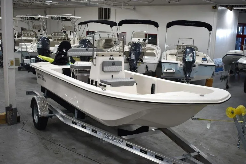 Slide: The Image of 2025 Carolina Skiff E20 JVX Center Console boat on trailer in showroom. - 3