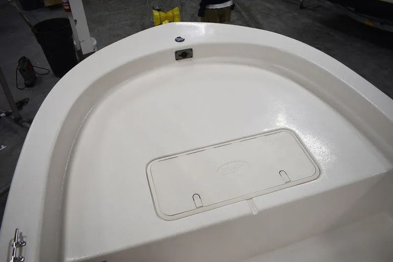 Slide: The Image of 2025 Carolina Skiff E20 JVX Center Console boat deck, featuring a storage compartment. - 30
