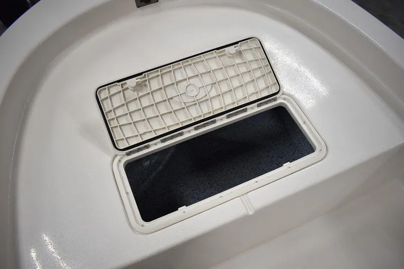 Slide: The Image of Open storage compartment on 2025 Carolina Skiff E20 JVX Center Console boat. - 31