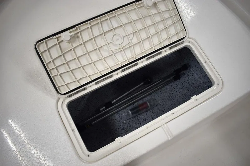 Slide: The Image of Open storage compartment in 2025 Carolina Skiff E20 JVX Center Console boat. - 32