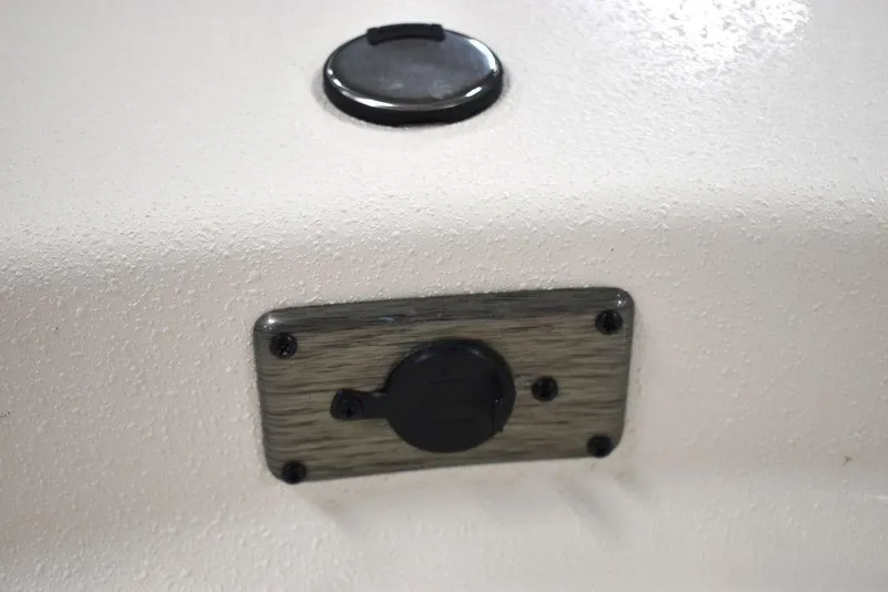 Slide: The Image of 2025 Carolina Skiff E20 JVX Center Console detail, featuring a mounted plug socket. - 33