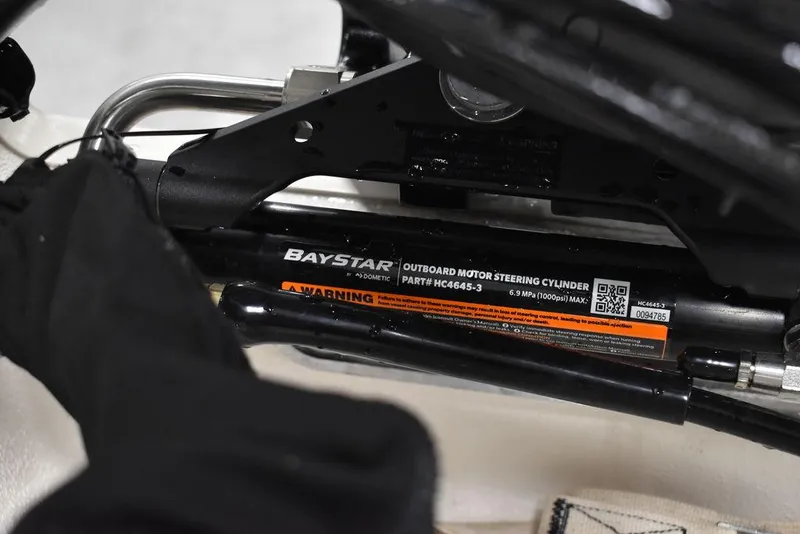 Slide: The Image of BayStar outboard motor steering cylinder on 2025 Carolina Skiff E20 JVX Center Console. - 34