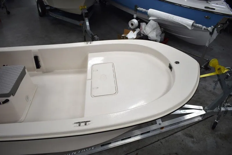 Slide: The Image of 2025 Carolina Skiff E20 JVX Center Console boat on trailer in showroom. - 5