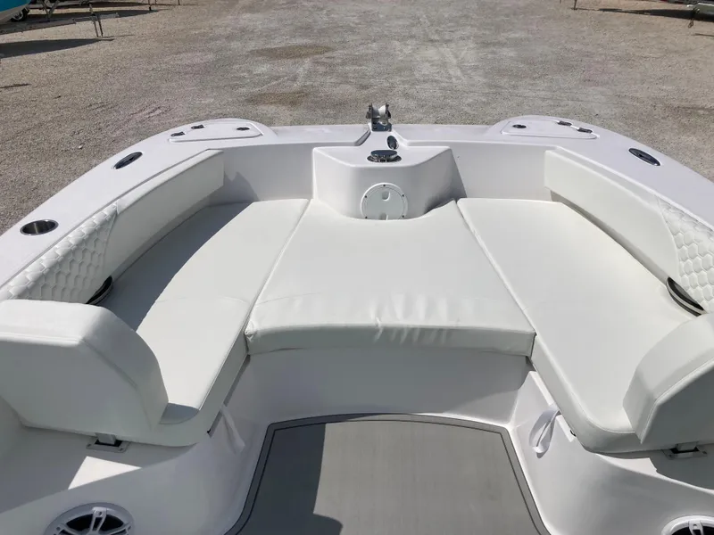 Slide: The Image of 2025 Twin Vee 240GFX boat interior with white cushioned seating. - 9