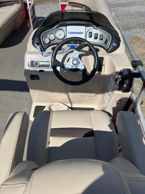 Slide: The Image of 2017 Sun Tracker Party Barge 20 DLX helm with Lowrance system and beige seating. - 12