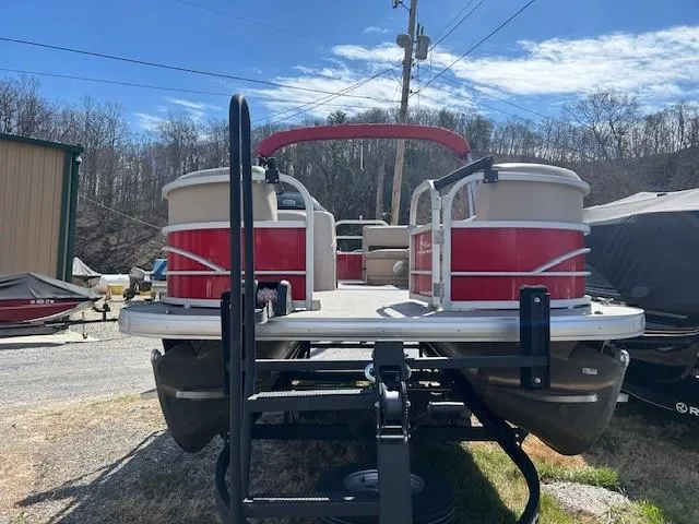 Slide: The Image of 2017 Sun Tracker Party Barge 20 DLX pontoon boat on trailer, red and white design. - 3