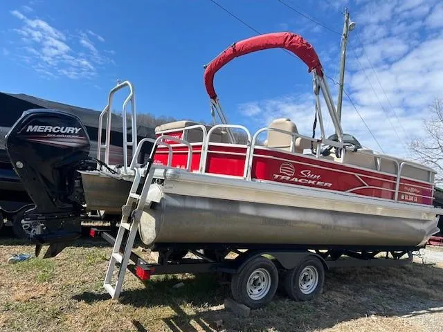 Slide: The Image of 2017 Sun Tracker Party Barge 20 DLX pontoon boat on trailer, with Mercury outboard motor. - 5