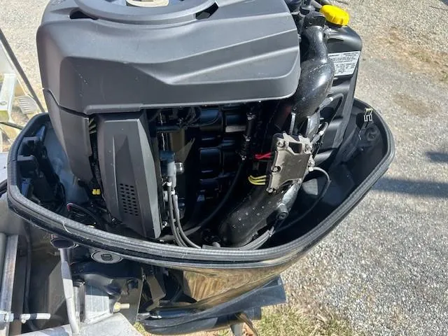 Slide: The Image of 2017 Sun Tracker Party Barge 20 DLX outboard motor close-up, showcasing engine details. - 8