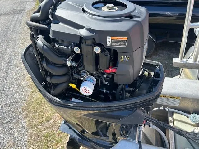 Slide: The Image of 2017 Sun Tracker Party Barge 20 DLX outboard motor close-up. - 9