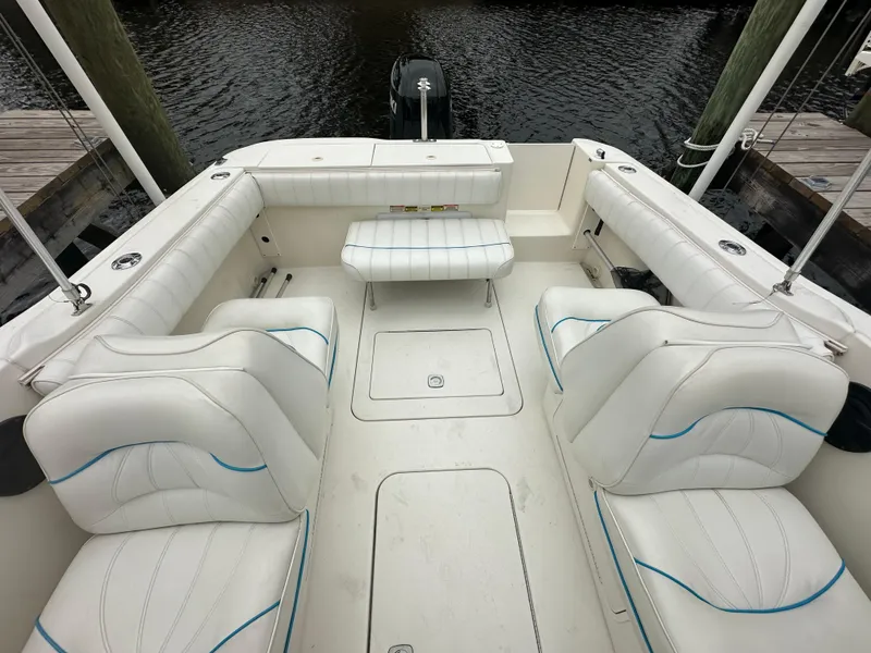 Slide: The Image of 1997 Sea Ray Laguna 21 boat interior with white seating and spacious layout. - 14
