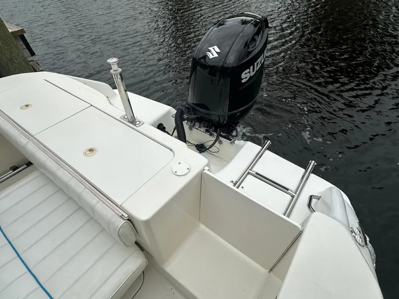 Slide: The Image of 1997 Sea Ray Laguna 21 boat with Suzuki outboard motor on calm water. - 15