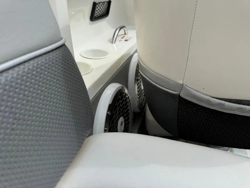 Slide: The Image of Interior of 2005 Yamaha Boats 230 SX, featuring seating and built-in speakers. - 13