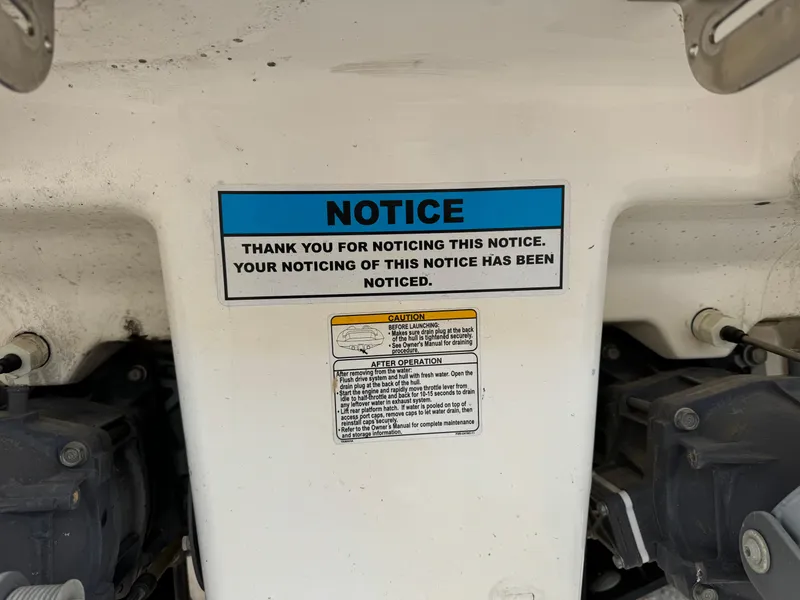 Slide: The Image of Yamaha Boats 2005 230 SX notice sign with humorous message on boat interior. - 18