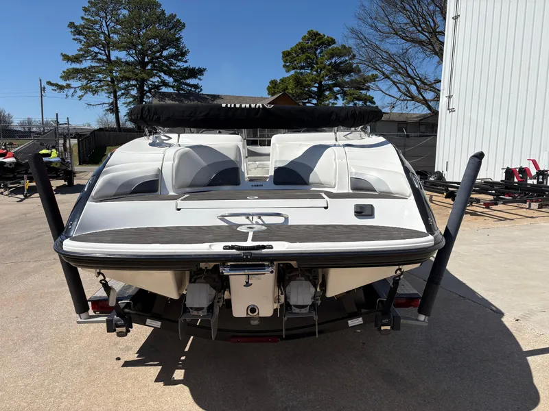 Slide: The Image of 2005 Yamaha Boats 230 SX, rear view, parked outdoors, showcasing dual engines and seating. - 5