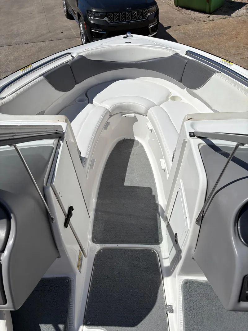 Slide: The Image of 2005 Yamaha Boats 230 SX interior with seating and open deck view. - 8