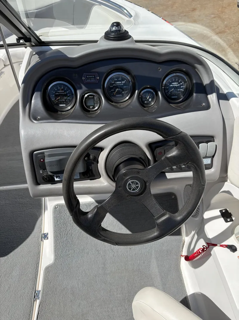 Slide: The Image of 2005 Yamaha Boats 230 SX dashboard with steering wheel and instrument panel. - 9