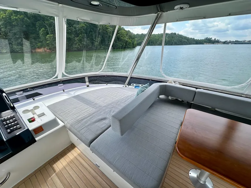 Slide: The Image of Luxurious 2021 Sirena 58 yacht interior with scenic water view and comfortable seating. - 27