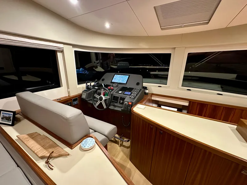 Slide: The Image of Luxurious 2021 Sirena 58 yacht interior with modern helm and wooden accents. - 30