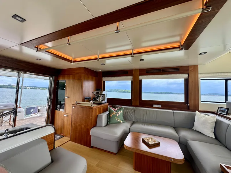 Slide: The Image of Luxurious interior of 2021 Sirena 58 yacht with elegant wood finishes and scenic ocean view. - 40