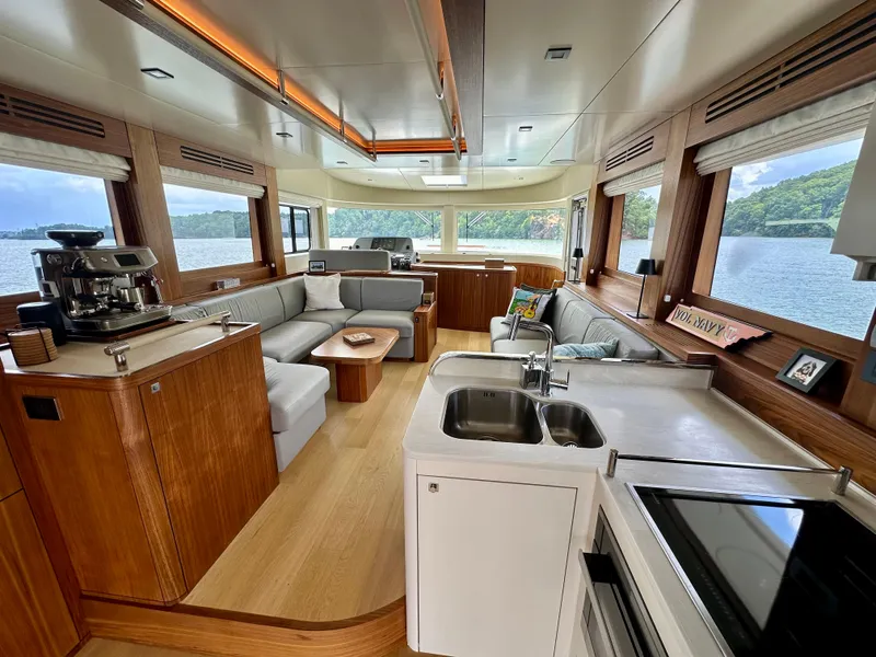 Slide: The Image of Luxurious interior of 2021 Sirena 58 yacht with modern kitchen and panoramic windows. - 44