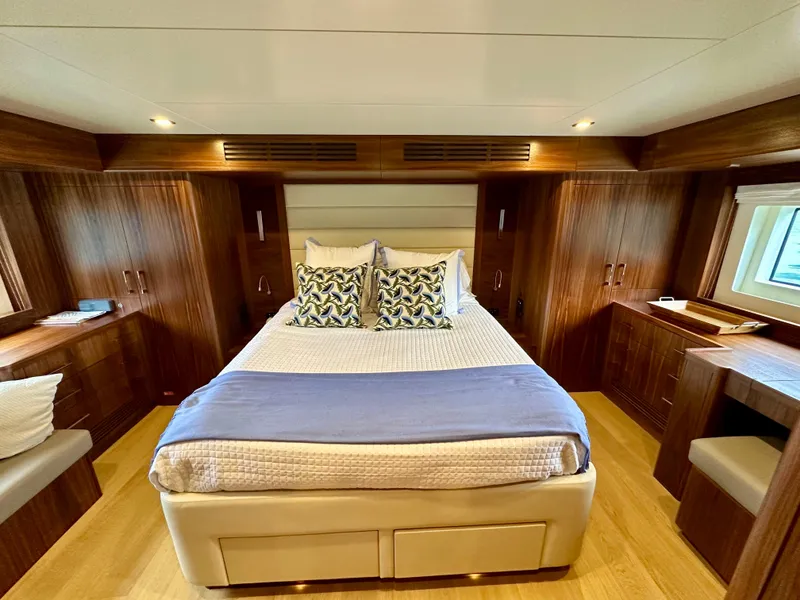 Slide: The Image of Luxurious cabin interior of 2021 Sirena 58 yacht with elegant wood finishes and cozy bedding. - 48