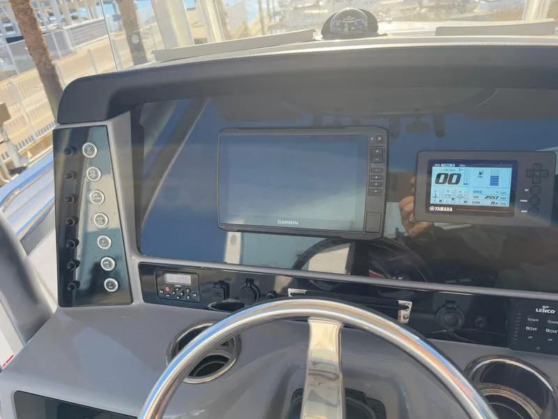 Slide: The Image of 2021 Robalo R230 Center Console dashboard with navigation and control systems. - 4