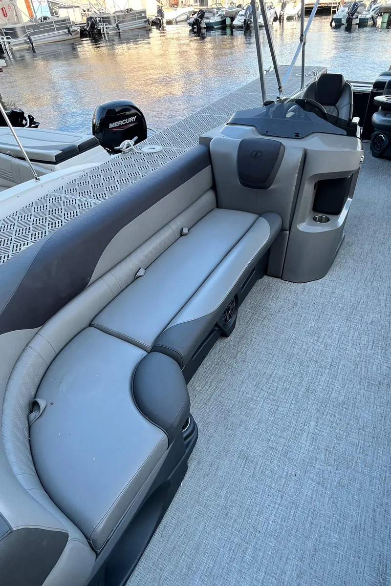 Slide: The Image of 2023 Tahoe Pontoon LTZ Cruise with sleek gray seating and modern design. - 14