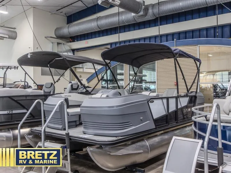 Slide: The Image of Pontoon boats displayed at Bretz RV & Marine showroom, featuring A-Series A20 LZ DH model, 2025. - 3