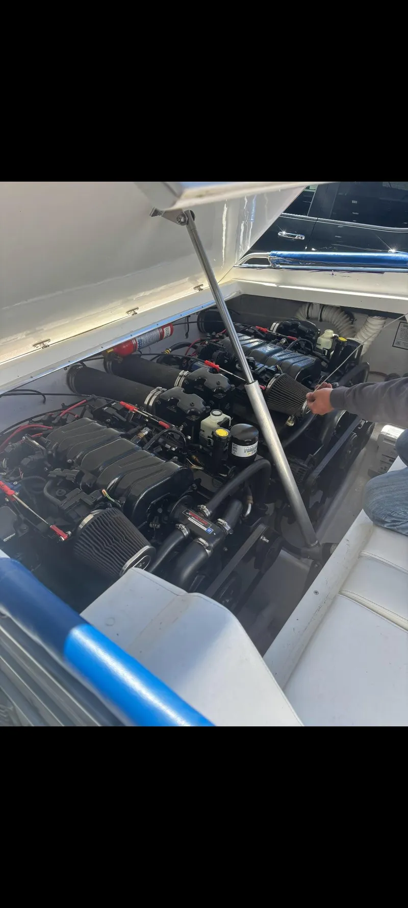 Slide: The Image of 2001 Sonic 31 SS boat engine compartment with dual engines visible. - 16