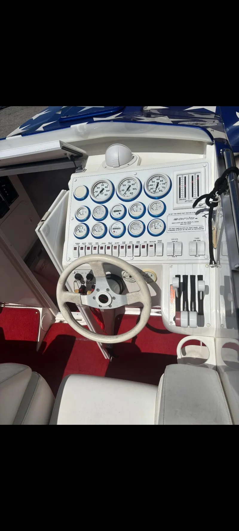 Slide: The Image of 2001 Sonic 31 SS boat dashboard with gauges and steering wheel. - 9